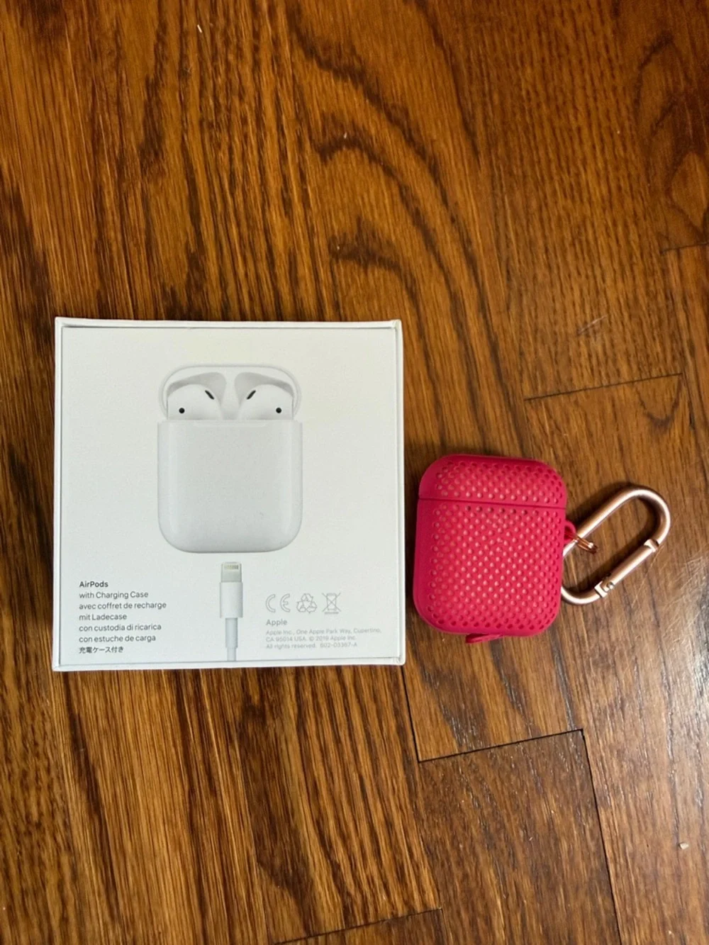 Apple Wireless Earbuds with Hot Pink Silicone Case and Carabiner